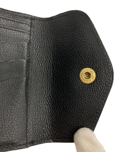 IL BISONTE（イル ビゾンテ）IL BISONTE (イル ビゾンテ) レザーフラップ二つ折りウォレット ブラックの古着・服飾アイテム
