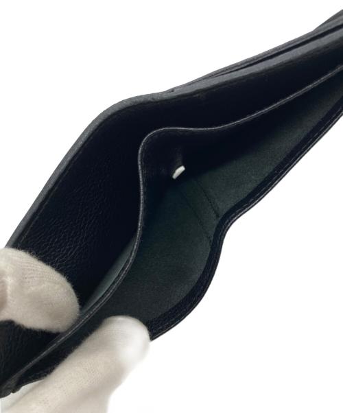 IL BISONTE（イル ビゾンテ）IL BISONTE (イル ビゾンテ) レザーフラップ二つ折りウォレット ブラックの古着・服飾アイテム