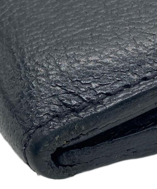 IL BISONTE（イル ビゾンテ）IL BISONTE (イル ビゾンテ) レザーフラップ二つ折りウォレット ブラックの古着・服飾アイテム