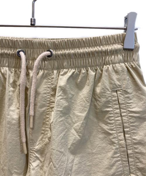 NEW BALANCE（ニューバランス）NEW BALANCE (ニューバランス) Shohei Signature Woven Nylon Pant / ショウヘイ シグネチャー ウーブン ナイロン パンツ ベージュ サイズ:SIZE XSの古着・服飾アイテム