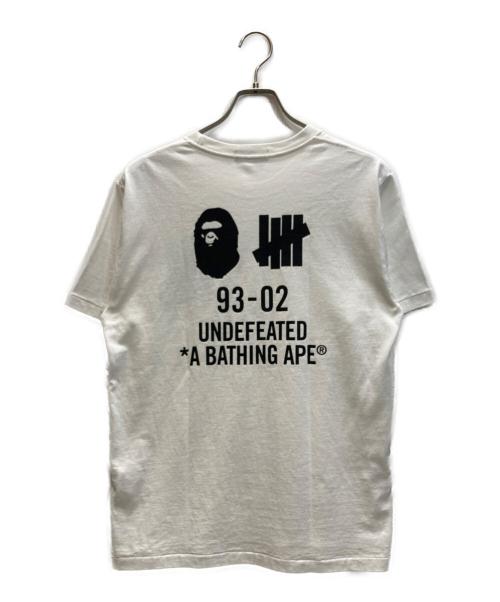A BATHING APE（アベイシングエイプ）A BATHING APE (アベイシングエイプ) UNDEFEATED BAPE Tシャツ ホワイト サイズ:Mの古着・服飾アイテム
