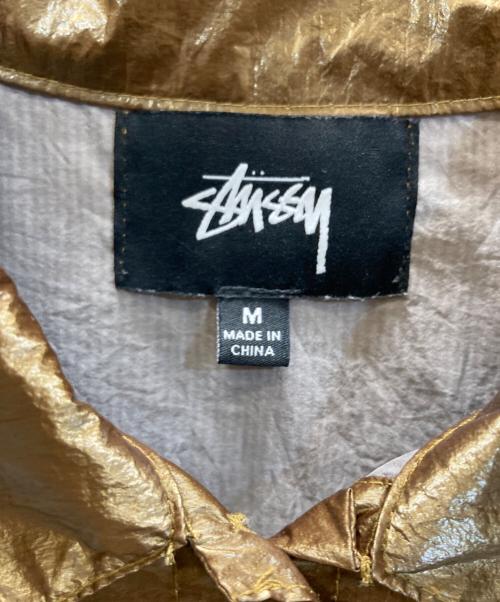 stussy（ステューシー）stussy (ステューシー) 半袖シャツ ゴールド サイズ:Mの古着・服飾アイテム