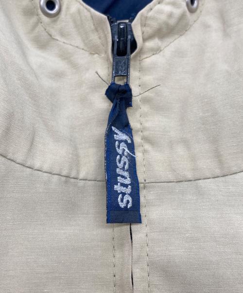 stussy（ステューシー）stussy (ステューシー) バイカラーフーデッドジャケット ベージュ×ネイビー サイズ:SIZE Mの古着・服飾アイテム