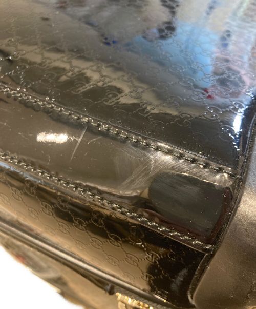 GUCCI（グッチ）GUCCI (グッチ) マイクログッチシマ エナメルキャリーバッグ 293909 200047 ブラックの古着・服飾アイテム