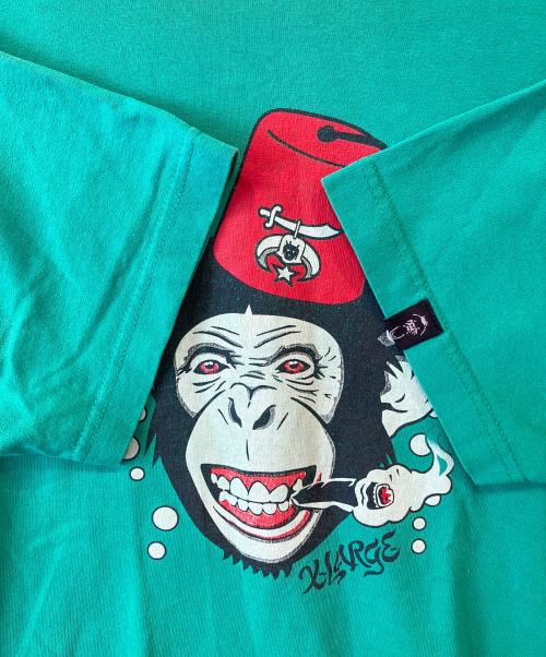 X-LARGE（エクストララージ）X-LARGE (エクストララージ) プリントTシャツ グリーン サイズ:Mの古着・服飾アイテム