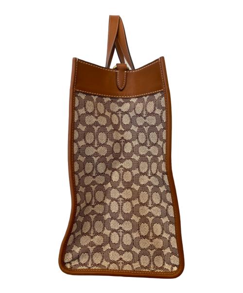 COACH（コーチ）COACH (コーチ) DISNEY (ディズニー) フィールド トート 40・シグネチャー テキスタイル ジャカード・パッチ　CG974 ブラウンの古着・服飾アイテム