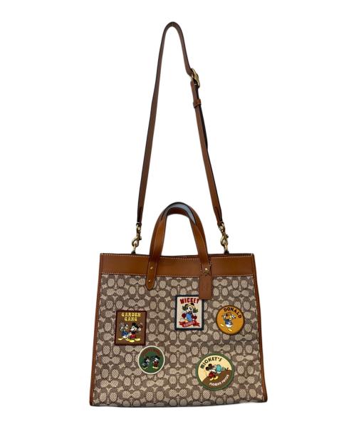 COACH（コーチ）COACH (コーチ) DISNEY (ディズニー) フィールド トート 40・シグネチャー テキスタイル ジャカード・パッチ　CG974 ブラウンの古着・服飾アイテム