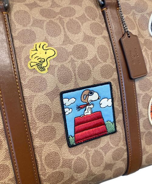 COACH（コーチ）COACH (コーチ) PEANUTS (ピーナッツ) ベンチュラー バッグ・シグネチャー キャンバス・パッチ/CBI42 ベージュの古着・服飾アイテム