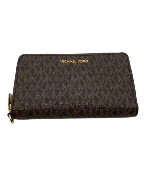 MICHAEL KORS（マイケルコース）MICHAEL KORS (マイケルコース) ジェットセットトラベルスマートフォンリストレット 35F8GTVW9B ブラウンの古着・服飾アイテム