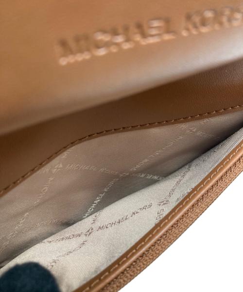 MICHAEL KORS（マイケルコース）MICHAEL KORS (マイケルコース) ジェットセットトラベルスマートフォンリストレット 35F8GTVW9B ブラウンの古着・服飾アイテム
