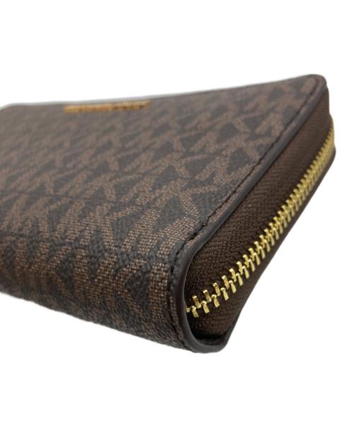 MICHAEL KORS（マイケルコース）MICHAEL KORS (マイケルコース) ジェットセットトラベルスマートフォンリストレット 35F8GTVW9B ブラウンの古着・服飾アイテム