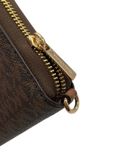 MICHAEL KORS（マイケルコース）MICHAEL KORS (マイケルコース) ジェットセットトラベルスマートフォンリストレット 35F8GTVW9B ブラウンの古着・服飾アイテム