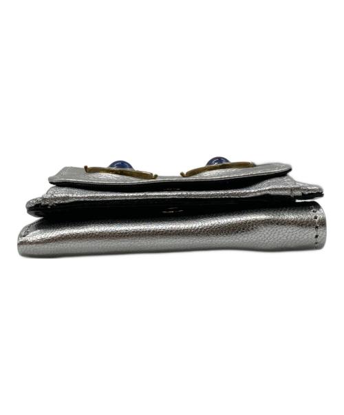 ahcahcum（アチャチュム）ahcahcum (アチャチュム) お目目の財布 シルバーの古着・服飾アイテム