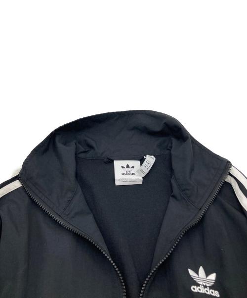 adidas（アディダス）adidas (アディダス) アディカラー ウーブン ファイヤーバード トラックトップ IT2491 ブラック サイズ:Mの古着・服飾アイテム