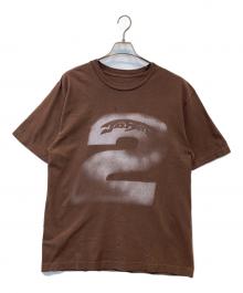 Travis Scott（トラヴィススコット）の古着「プリントTシャツ」｜ブラウン