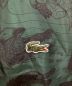 中古・古着 LACOSTE (ラコステ) NETFLIX (ネットフリックス) 総柄ジップアップジャケット グリーン サイズ:XL：16000円
