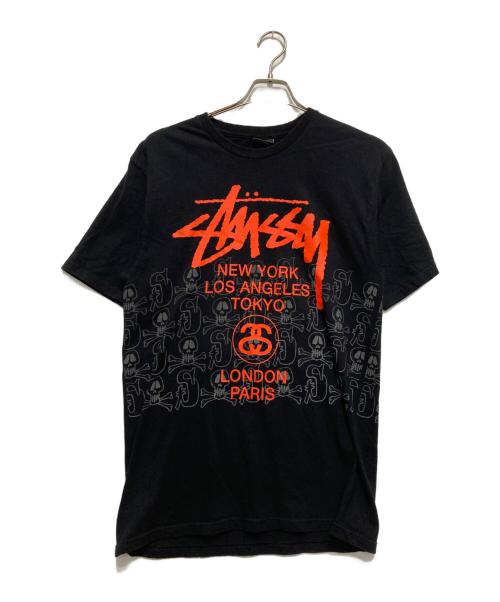 stussy（ステューシー）stussy (ステューシー) ワールドツアー×スカルロゴTシャツ ブラック サイズ:Mの古着・服飾アイテム