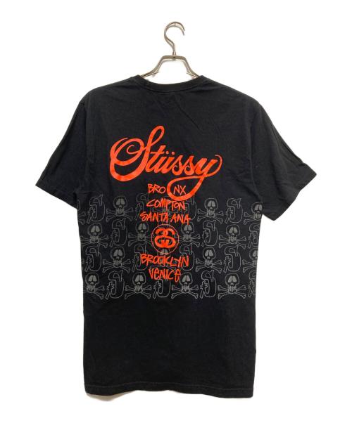 stussy（ステューシー）stussy (ステューシー) ワールドツアー×スカルロゴTシャツ ブラック サイズ:Mの古着・服飾アイテム