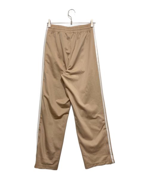 adidas（アディダス）adidas (アディダス) アディカラー クラシックス ファイヤーバード トラックパンツ ベージュ サイズ:XSの古着・服飾アイテム