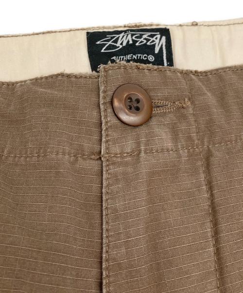 stussy（ステューシー）stussy (ステューシー) ペイントカーゴポケットパンツ ブラウン サイズ:32の古着・服飾アイテム
