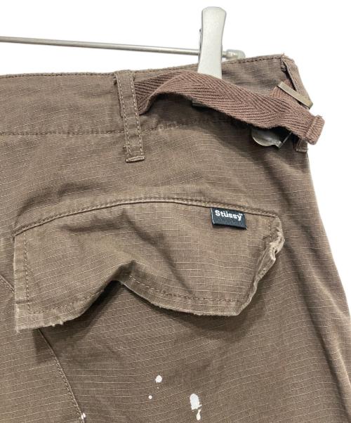 stussy（ステューシー）stussy (ステューシー) ペイントカーゴポケットパンツ ブラウン サイズ:32の古着・服飾アイテム