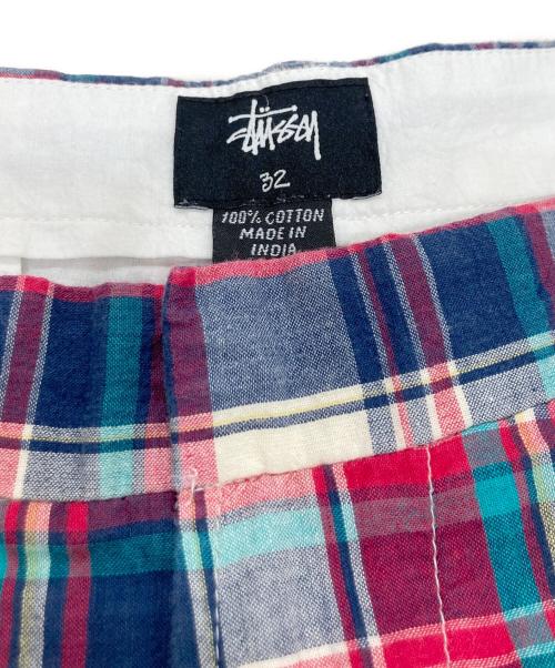 stussy（ステューシー）stussy (ステューシー) リンクロゴマドラスショートパンツ レッド×ネイビー サイズ:32の古着・服飾アイテム