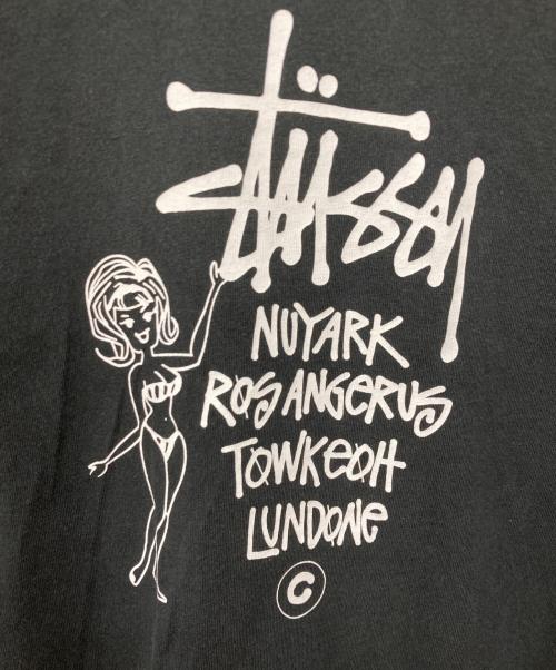 stussy（ステューシー）stussy (ステューシー) Champion (チャンピオン) Cities Girl Tee ブラック サイズ:MEDIUMの古着・服飾アイテム