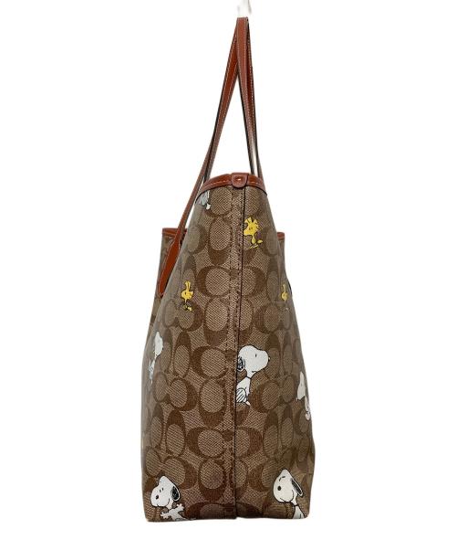 COACH（コーチ）COACH (コーチ) PEANUTS (ピーナッツ) シティー トート・シグネチャー スヌーピー ウッドストック ブラウンの古着・服飾アイテム