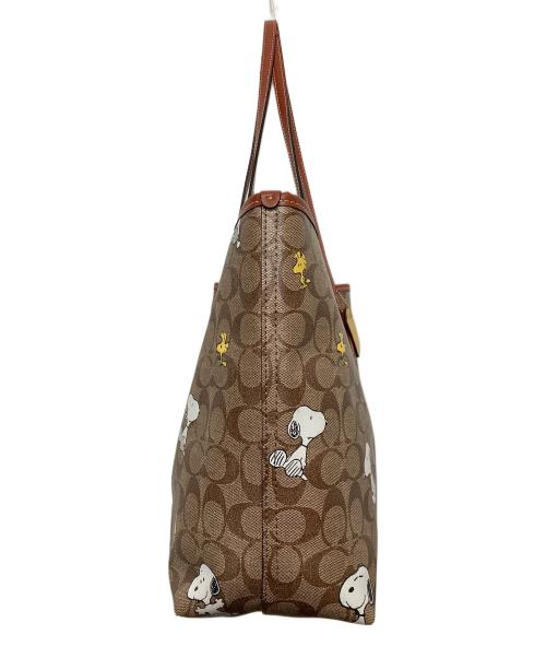 COACH（コーチ）COACH (コーチ) PEANUTS (ピーナッツ) シティー トート・シグネチャー スヌーピー ウッドストック ブラウンの古着・服飾アイテム