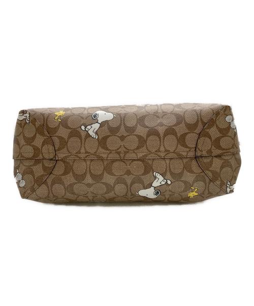 COACH（コーチ）COACH (コーチ) PEANUTS (ピーナッツ) シティー トート・シグネチャー スヌーピー ウッドストック ブラウンの古着・服飾アイテム