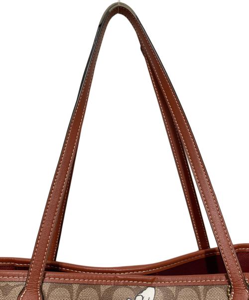 COACH（コーチ）COACH (コーチ) PEANUTS (ピーナッツ) シティー トート・シグネチャー スヌーピー ウッドストック ブラウンの古着・服飾アイテム