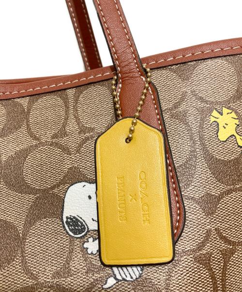 COACH（コーチ）COACH (コーチ) PEANUTS (ピーナッツ) シティー トート・シグネチャー スヌーピー ウッドストック ブラウンの古着・服飾アイテム
