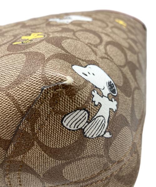 COACH（コーチ）COACH (コーチ) PEANUTS (ピーナッツ) シティー トート・シグネチャー スヌーピー ウッドストック ブラウンの古着・服飾アイテム