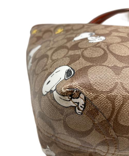 COACH（コーチ）COACH (コーチ) PEANUTS (ピーナッツ) シティー トート・シグネチャー スヌーピー ウッドストック ブラウンの古着・服飾アイテム