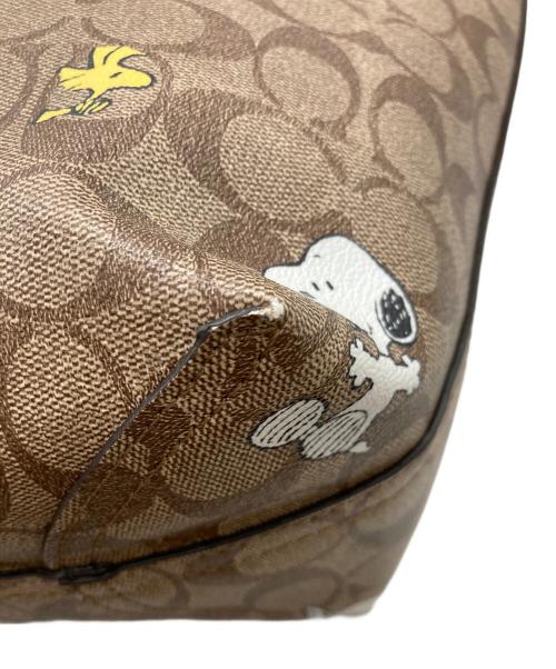 COACH（コーチ）COACH (コーチ) PEANUTS (ピーナッツ) シティー トート・シグネチャー スヌーピー ウッドストック ブラウンの古着・服飾アイテム