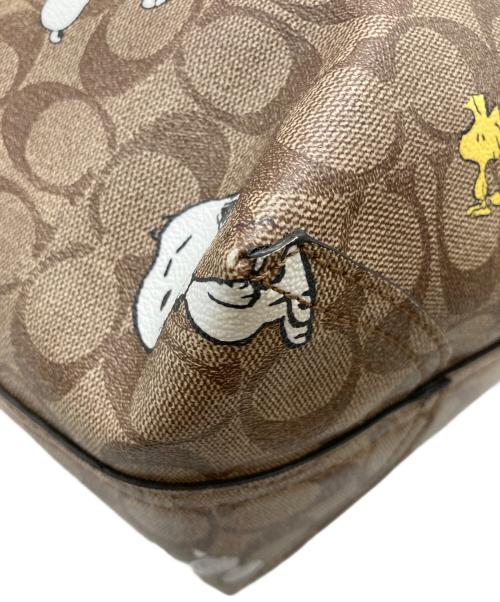 COACH（コーチ）COACH (コーチ) PEANUTS (ピーナッツ) シティー トート・シグネチャー スヌーピー ウッドストック ブラウンの古着・服飾アイテム