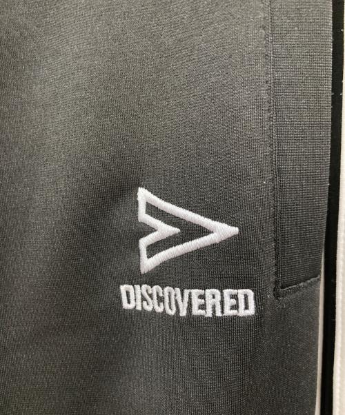 DISCOVERED（ディスカバード）DISCOVERED (ディスカバード) OPENING act (オープニングアクト) リメイクトラックパンツ ブラック サイズ:FREEの古着・服飾アイテム