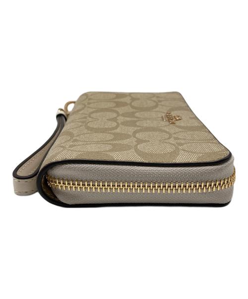 COACH（コーチ）COACH (コーチ) ロングジップアラウンドウォレットシグネチャーキャンバス ベージュの古着・服飾アイテム