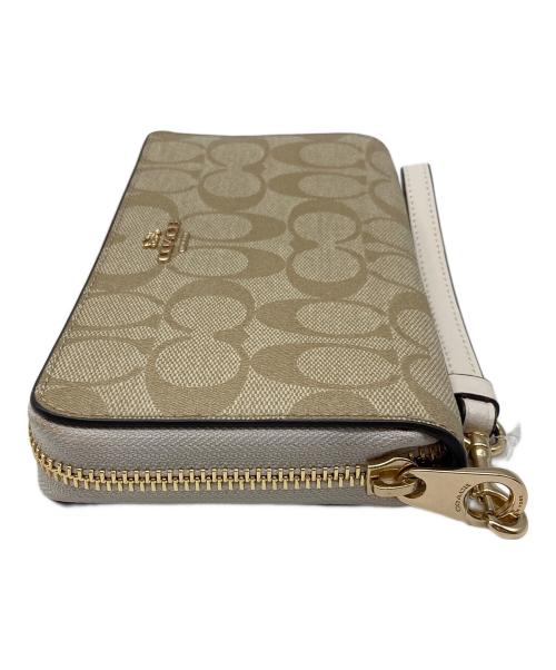 COACH（コーチ）COACH (コーチ) ロングジップアラウンドウォレットシグネチャーキャンバス ベージュの古着・服飾アイテム