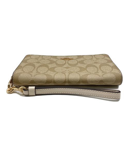 COACH（コーチ）COACH (コーチ) ロングジップアラウンドウォレットシグネチャーキャンバス ベージュの古着・服飾アイテム
