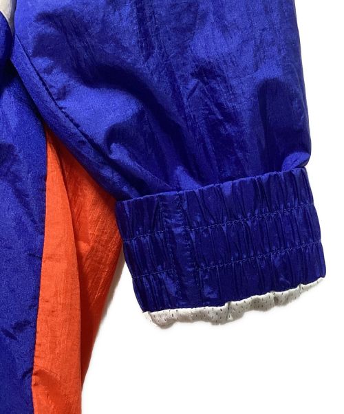 MITCHELL & NESS（ミッチェルアンドネス）MITCHELL & NESS (ミッチェルアンドネス) HARDWOOD CLASSICS (ハードウッドクラシック) ナイロンジャケット ブルー×オレンジ サイズ:XLの古着・服飾アイテム