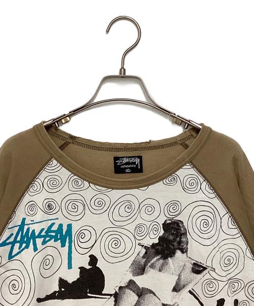 stussy（ステューシー）stussy (ステューシー) ラグランカットソー ホワイト×ブラウン サイズ:XLの古着・服飾アイテム