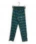Palm Angels（パーム エンジェルス）の古着「バーニング柄トラックパンツ」｜グリーン×ブルー