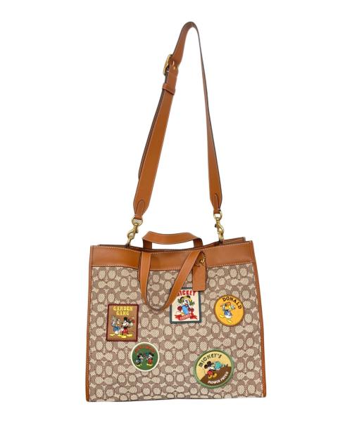 COACH（コーチ）COACH (コーチ) DISNEY (ディズニー) フィールド トート 40・シグネチャー テキスタイル ジャカード・パッチ ブラウン×ベージュの古着・服飾アイテム