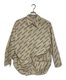 BALENCIAGA（バレンシアガ）の古着「Year of the tiger Typo Twisted Swing Shirt」｜ベージュ