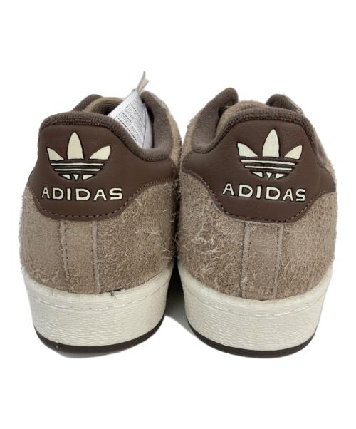 adidas（アディダス）adidas TMNT Teenage Mutant Ninja Turtles (ティーンエイジ ミュータント ニンジャ タートルズ) TMNT SHELLTOE ローカットスニーカー ブラウン×レッド サイズ:28 未使用品の古着・服飾アイテム