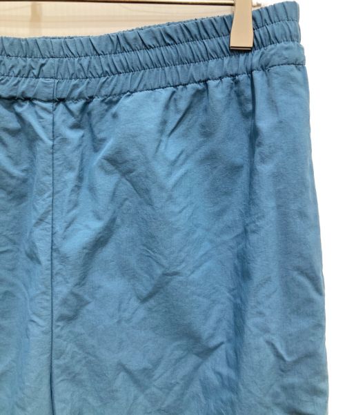 UNIVERSAL PRODUCTS.（ユニバーサルプロダクツ）UNIVERSAL PRODUCTS. (ユニバーサルプロダクツ) NYLON SHELL TRACK PANTS/ナイロンシェルトラックパンツ ブルー サイズ:3の古着・服飾アイテム