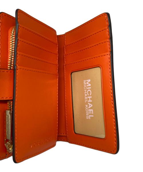 MICHAEL KORS（マイケル・コース）MICHAEL KORS (マイケルコース) 2つ折り財布 オレンジの古着・服飾アイテム