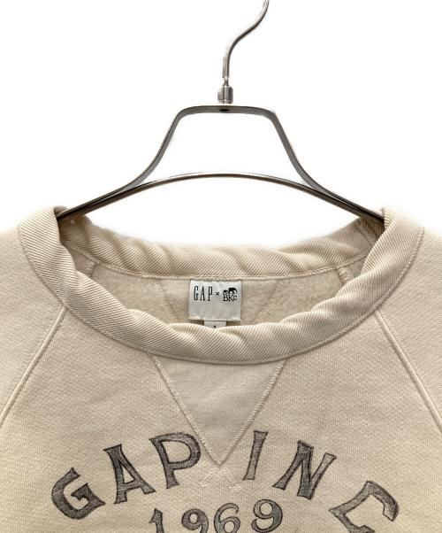 GAP（ギャップ）GAP (ギャップ) BKC (ビーケイシー) クルーネックスウェット アイボリー サイズ:S 未使用品の古着・服飾アイテム