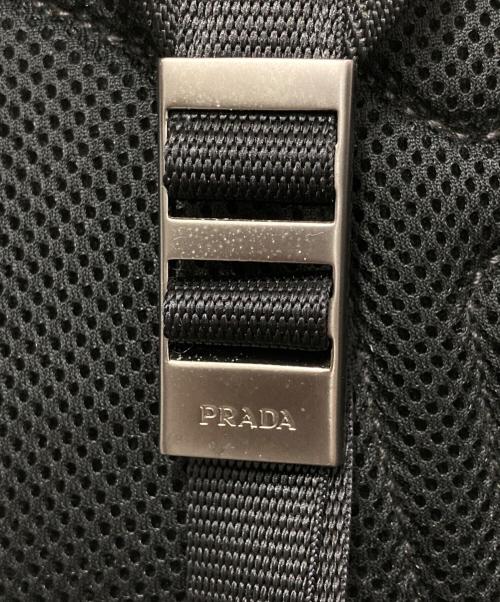 PRADA（プラダ）PRADA (プラダ) カモ柄サイドロゴナイロンバックパック ネイビー×ブラックの古着・服飾アイテム